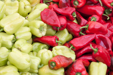 green and red peppers for sale at grocery