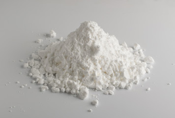 White Powder of Gypsum, Clay or Diatomite Isolated on Grey Background