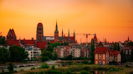 Beautiful and colorful cityscape of Gdansk, St. Mary's Basilica at sunset.