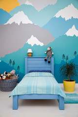 Cute boy bedroom design with a turquoise grey mountain wall mural