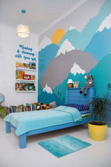 Cute boy bedroom design with a turquoise grey mountain wall mural