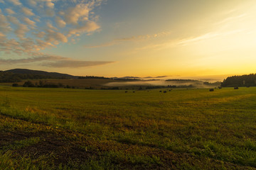 Summer landscape while sunrise in the Czech Republic near the National park of Sumava.