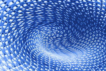 Spherical warp of space at edge of shot in blue. Fantastic background image of wormhole of metallic...