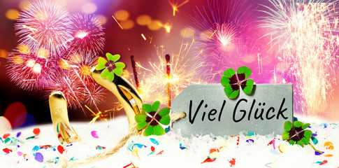Card with candlestick and lucky clover