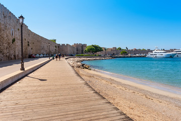 Fototapeta na wymiar Wooden coastal promenade in Rhodes town. Greece