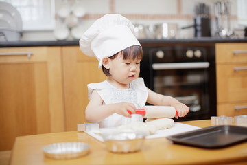 baby girl pretend baking at home