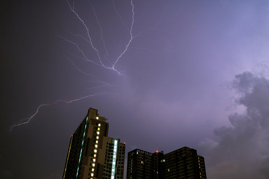 Awesome View of Real Lightning Striking on Night Sky over the High Building 
