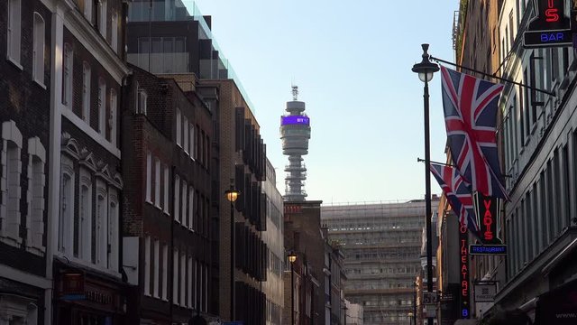 Establishing shot of a street in London with BT tower in distance.