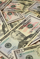 Closed up heap of United States fifty dollar bills, vertical photo 