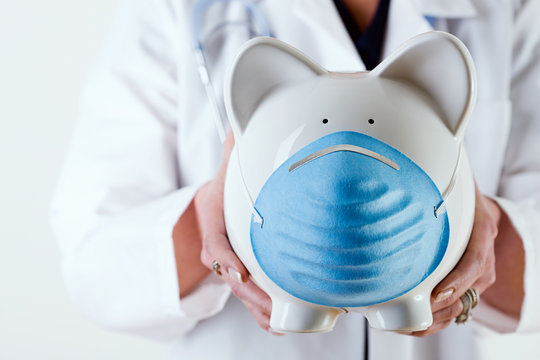 Healthcare: Holding Piggy Bank With Mask