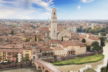 Fototapeta na wymiar Beautiful view of the panorama of Verona, the Lamberti tower and the Ponte Pietra bridge in Verona, Italy
