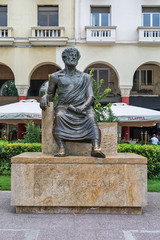 Fototapeta premium Thessaloniki, Greece - August 16, 2018: Main sight of city. The sculpture of the ancient Greek philosopher Aristotle in the historic center of the city on the Aristotelous Square.