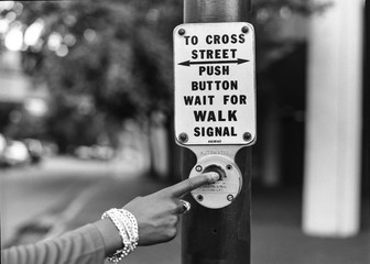 Finger pushing cross walk button