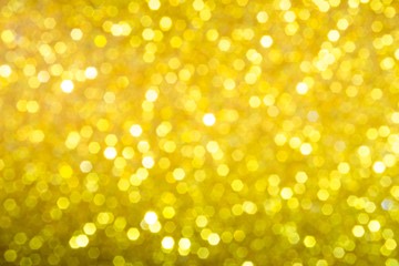 golden blur abstract background. yellow bokeh christmas blurred beautiful shiny Christmas lights