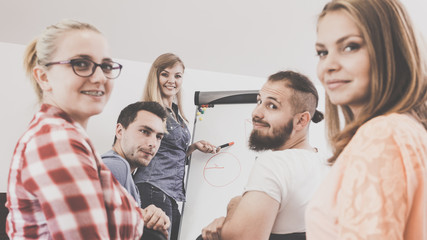 Teacher teaching mathematics to college students