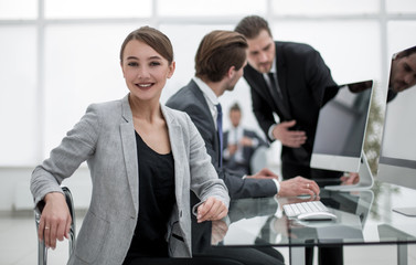 successful young woman in the workplace in the office
