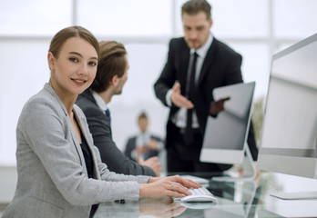 young employee sitting at his Desk.