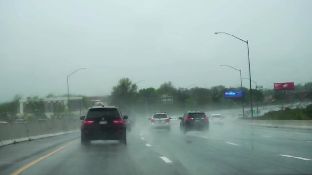Driving on a highway in a storm, in slow motion