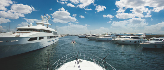 Motor yacht on the dock, yacht stern to berth