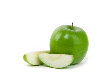 Granny smith apple and slices on isolated white background