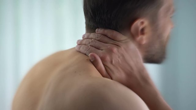 Man Feels Neck Pain After Woke Up In Morning, Uncomfortable Matrass, Closeup