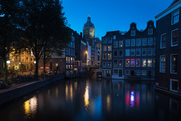 Night colors reflected on the canal water in Amsterdam, The Netherlands