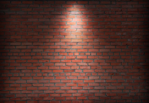 brick wall and spotlight.  scene illuminated spotlight.  bricks wall background.