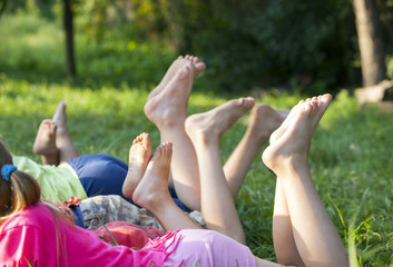Fototapeta premium children lying on green grass