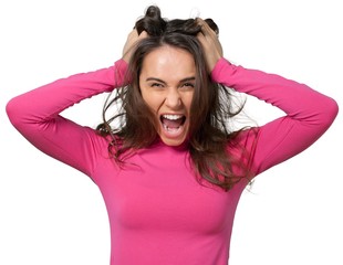 Frustrated young woman pulling her own hair