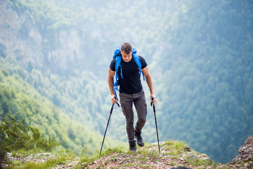 Active male hiker enjoying at mountain