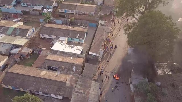 Aerial over rioting, fires and riots in the Kibera slum of Nairobi during controversial elections in Kenya in 2018.