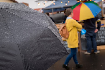 umbrella in the rain at a street market 