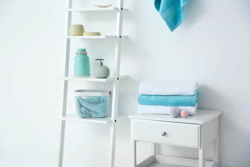 Obraz na płótnie Canvas Room interior with clean towels and toiletries