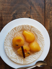 Sweet pear in syrup with cinnamon and cloves