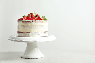 Delicious homemade cake with fresh berries and space for text on light background