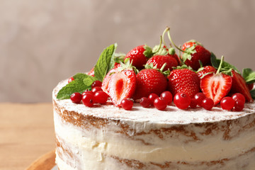 Delicious homemade cake with fresh berries on table, closeup