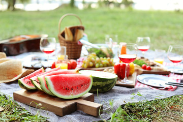 Blanket with food prepared for summer picnic outdoors