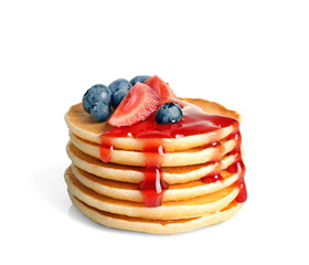Stack of pancakes with berries and syrup on white background