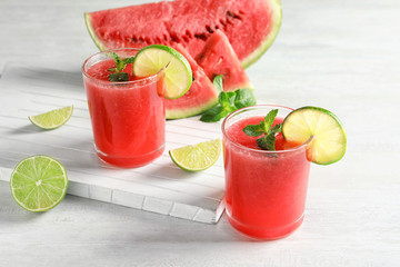 Tasty summer watermelon drink in glasses served on table