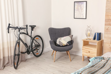 Modern apartment interior with bicycle near window