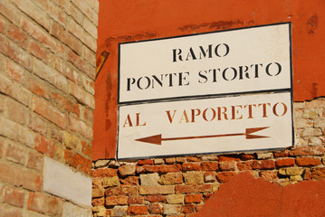'Vaporetto' (venetian water bus) old traditional road sign on a wall in Venice