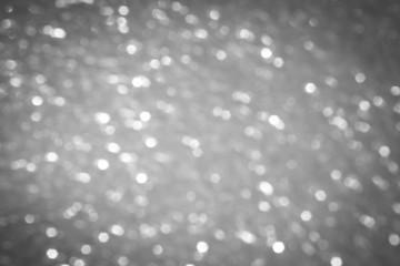gray blur abstract background. bokeh Christmas blurred beautiful shiny Christmas lights