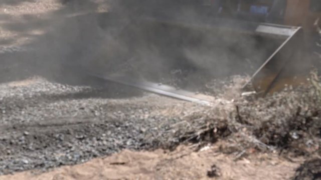 Moving gravel in skid steer