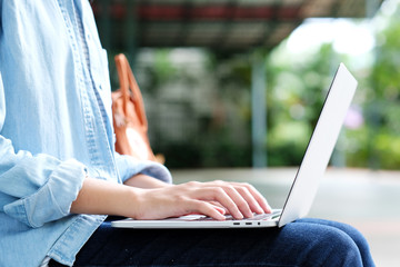 Student girl using laptop computer, online education,  adult learning concept