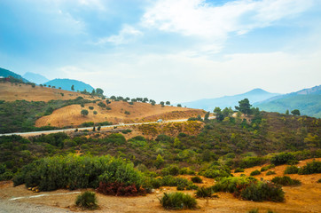 Fototapeta premium Desert road with Atlas Mountains, Morocco