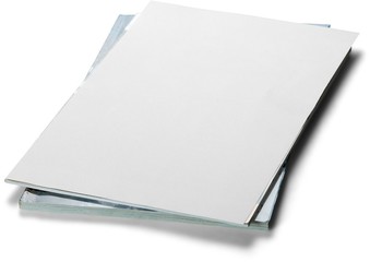 Stack of papers and magazines with a blank cover on top
