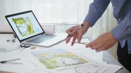 Landscape architect working on a backyard plan