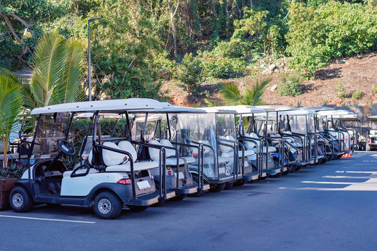 A Row Of Golf Buggies On Hamilton Island, Whitsundays, Australia