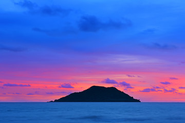 Fototapeta na wymiar Sunset at seascape with mountain
