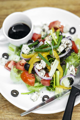 traditional greek salad with feta cheese and mixed organic vegetables